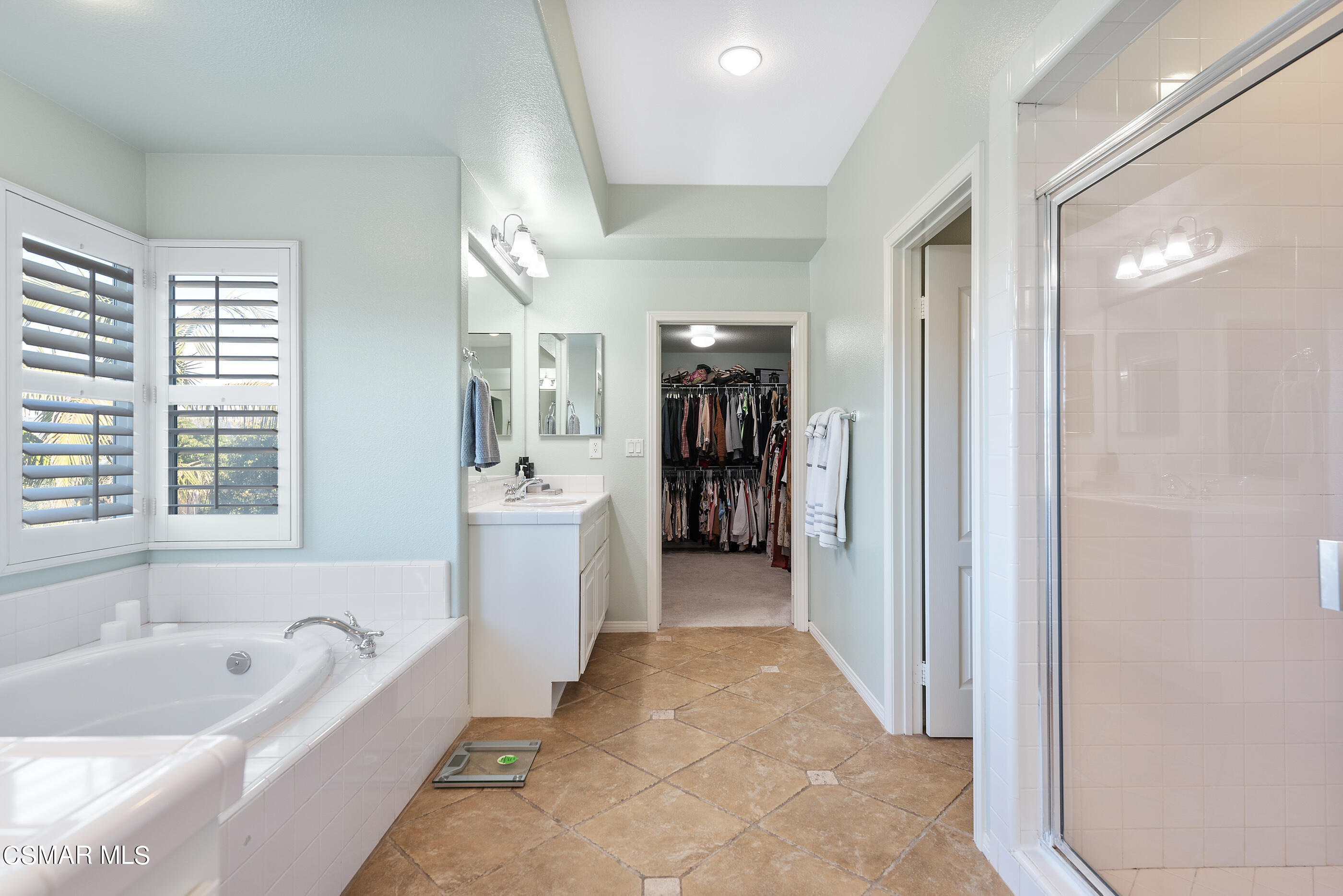 1997 Arielle Lane Simi Valley, CA 93065 - Photo 31 of 54 a bathroom with a tub a sink a mirror a window and a shower