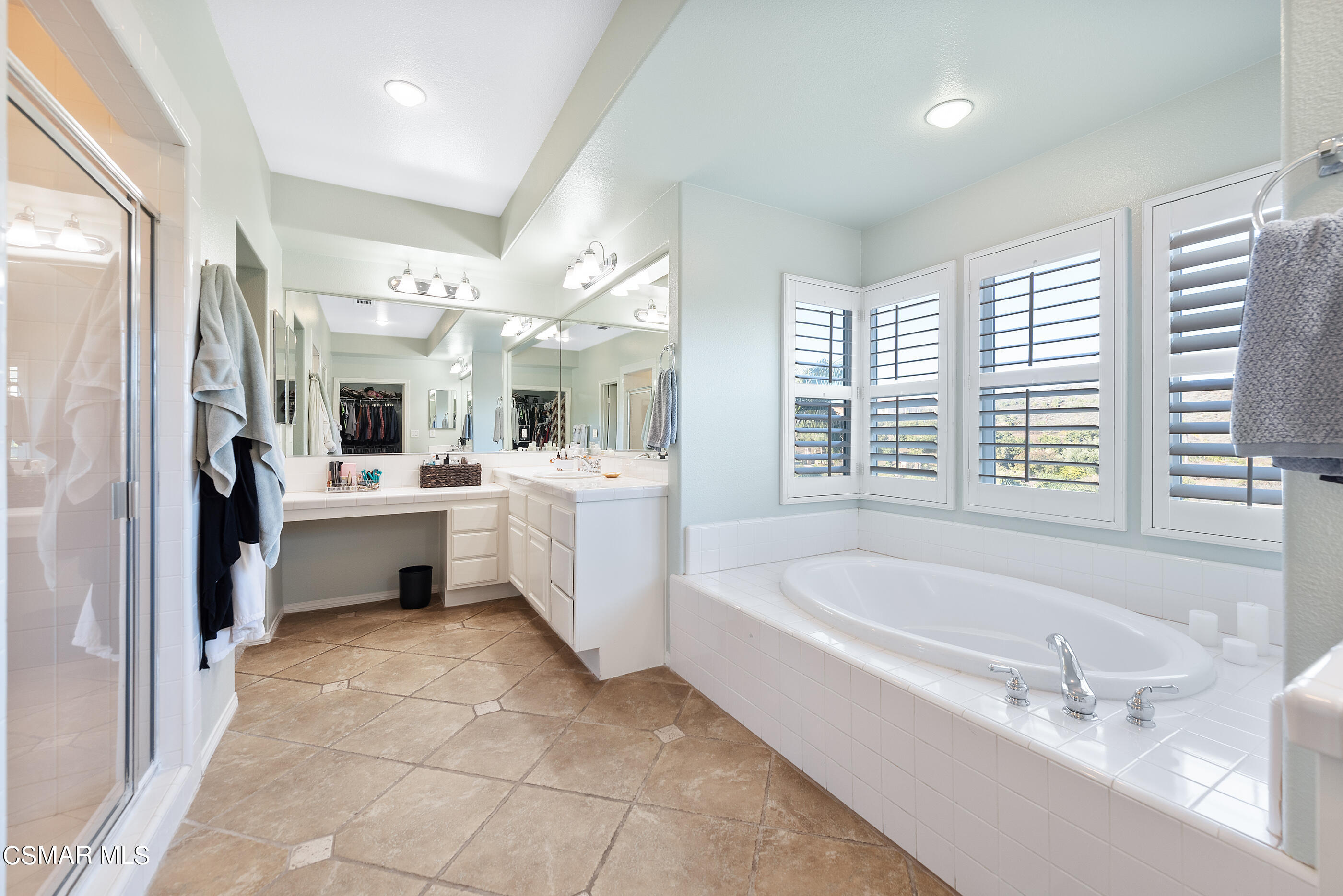 1997 Arielle Lane Simi Valley, CA 93065 - Photo 32 of 54 a bathroom with a tub a sink a mirror and a shower