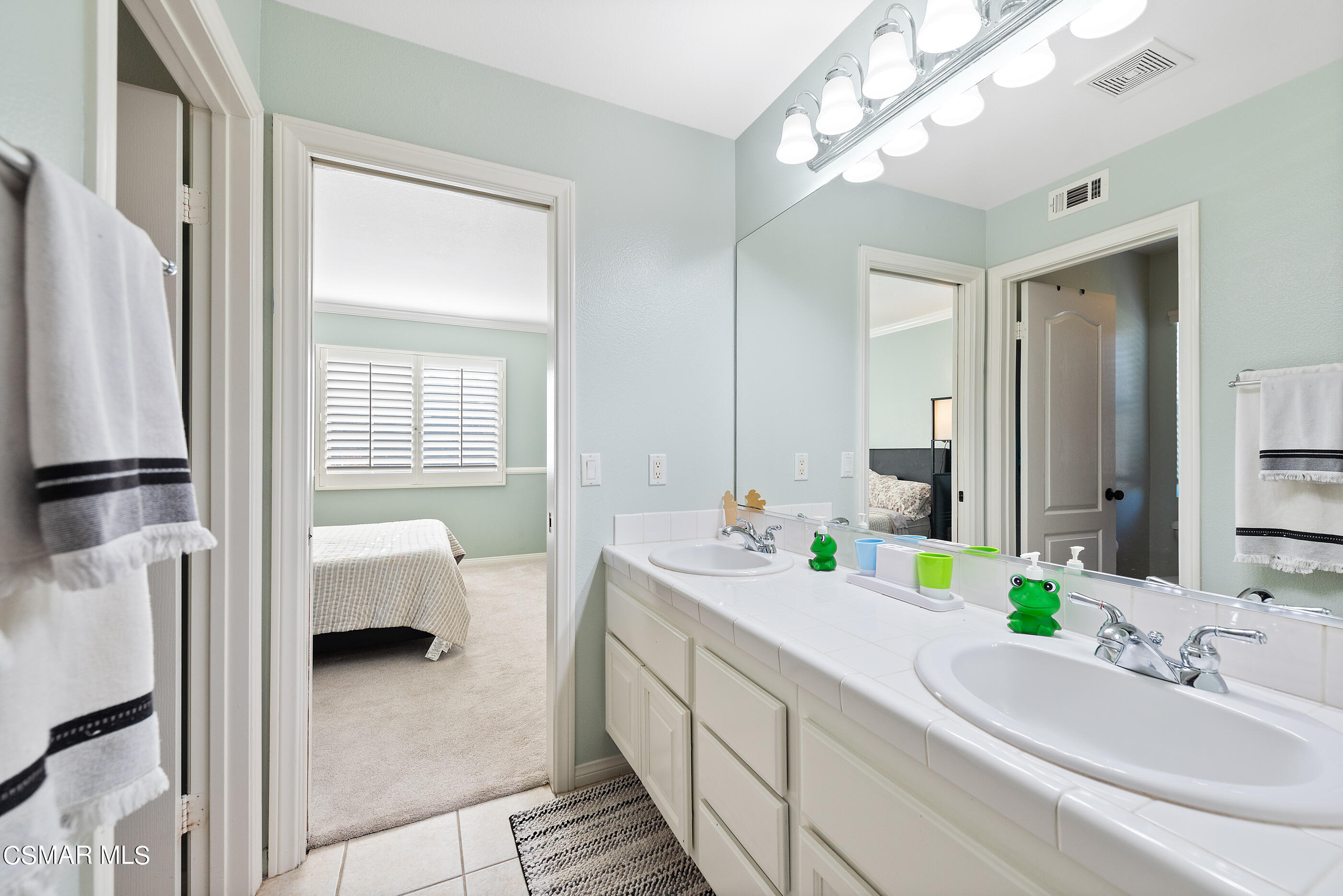 1997 Arielle Lane Simi Valley, CA 93065 - Photo 35 of 54 a bathroom with a double vanity sink and a mirror