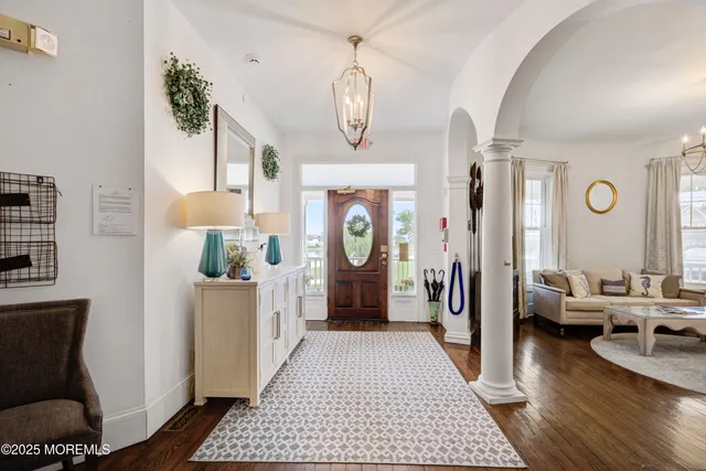 a living room with fireplace furniture and a flat screen tv