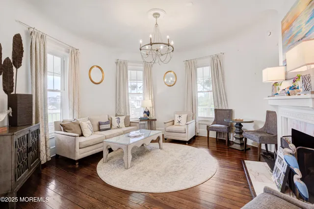 a living room with furniture or wooden floor and a chandelier