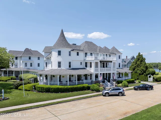an aerial view of multiple house with a swimming pool outdoor seating and yard