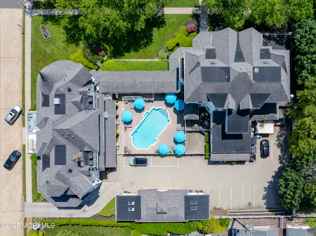 an aerial view of a house with outdoor space