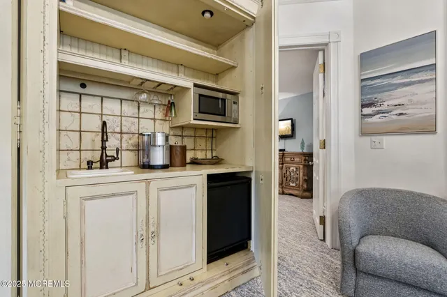 a kitchen with stainless steel appliances granite countertop a refrigerator and a cabinets