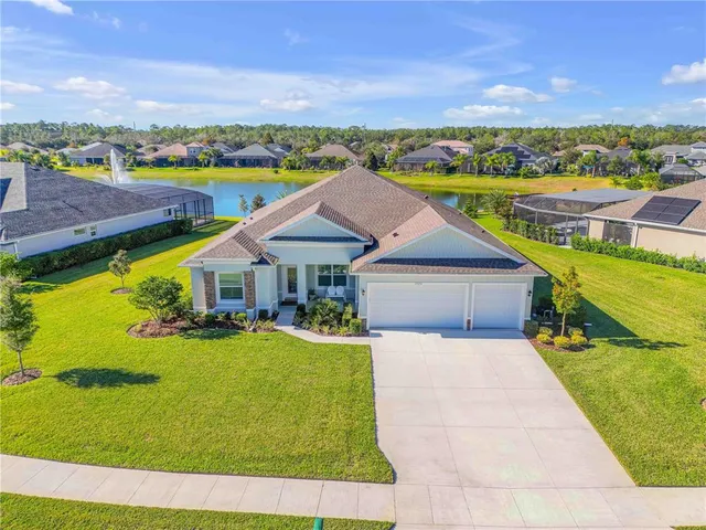 an aerial view of house with yard swimming pool and mountains