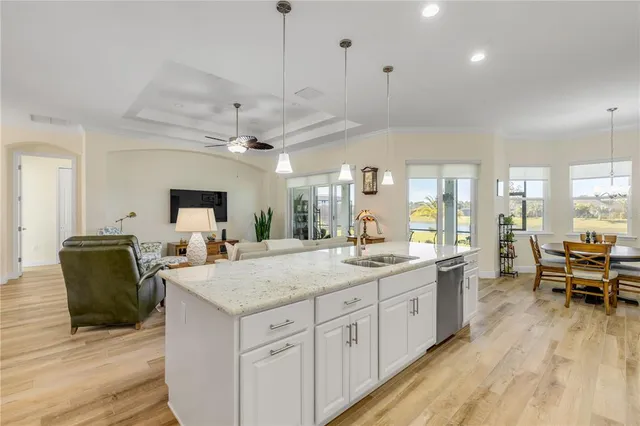 a view of center island wooden floor furniture and a window