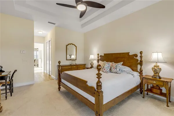 a spacious bathroom with a granite countertop sink and a mirror