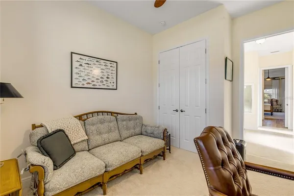 a bedroom with a bed and lamps