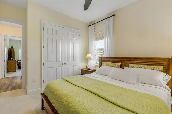 a bathroom with a granite countertop sink a toilet and a mirror