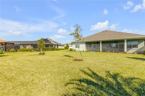 an aerial view of a house with a swimming pool