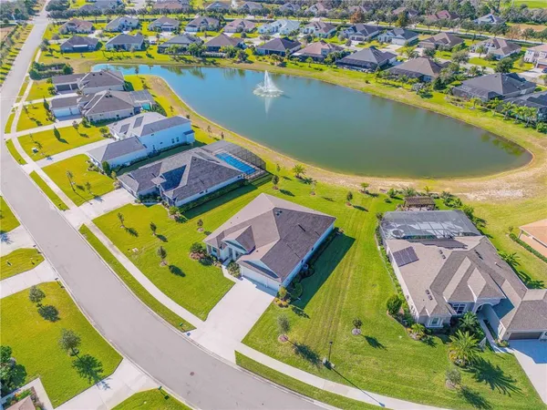 an aerial view of a house with a swimming pool