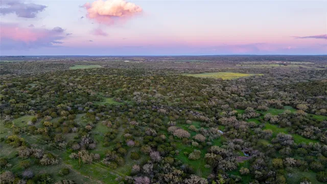 an aerial view of a houses with a outdoor space