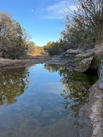 a view of lake with green space