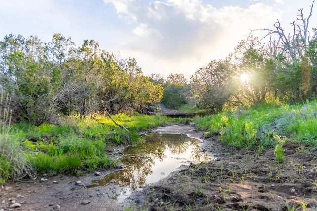 a view of a lake view with houses in back
