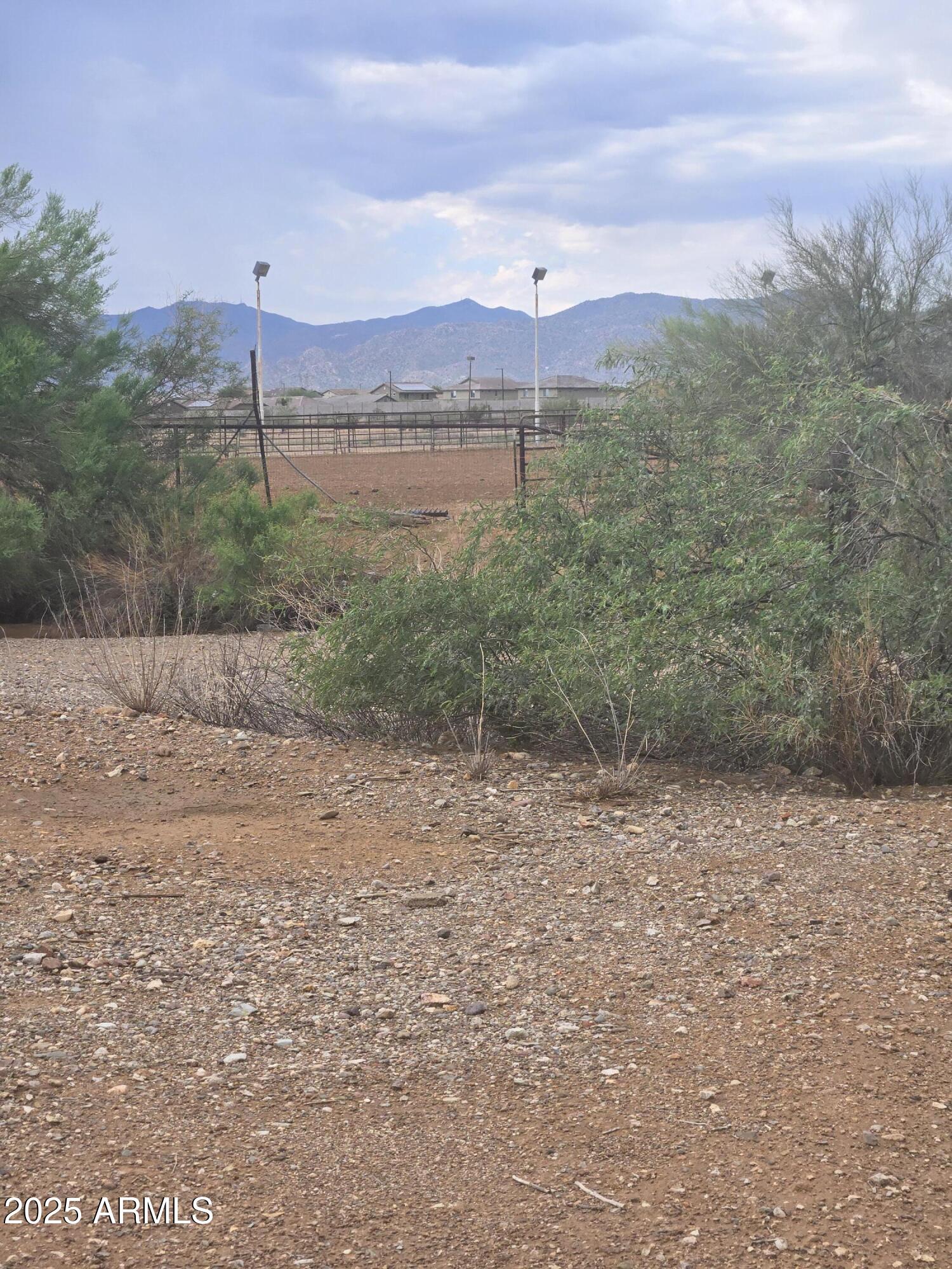 17963 West Patrick Lane, Unit 5 Surprise, AZ 85387 - Photo 1 of 15 a view of a lake with a mountain in the background