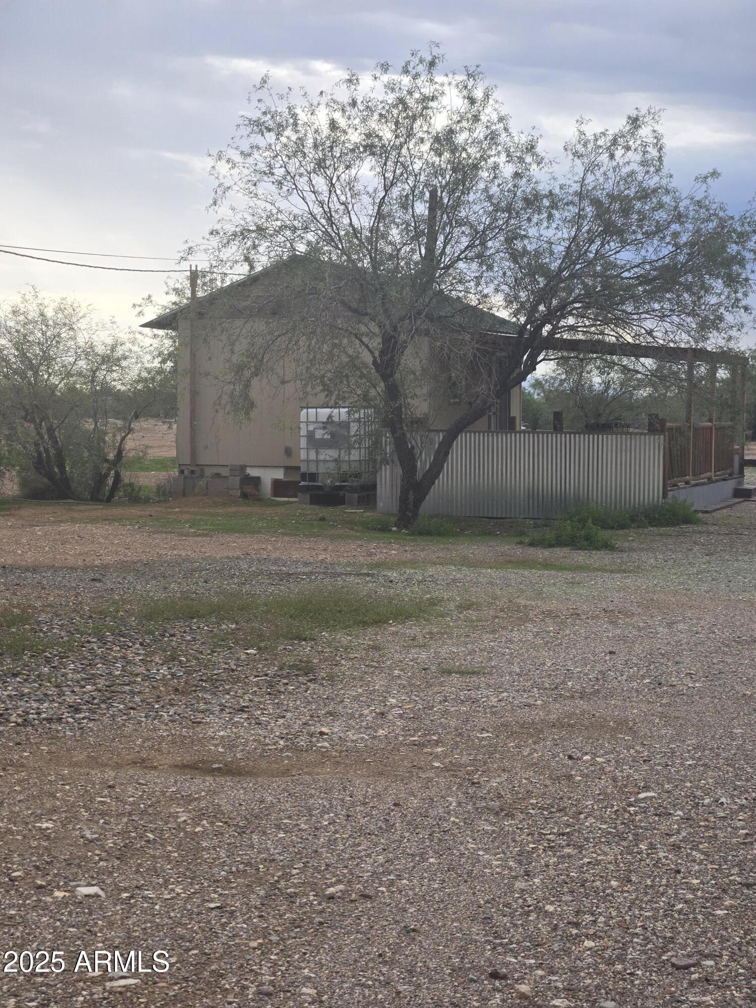 17963 West Patrick Lane, Unit 5 Surprise, AZ 85387 - Photo 12 of 15 a view of a yard with large trees