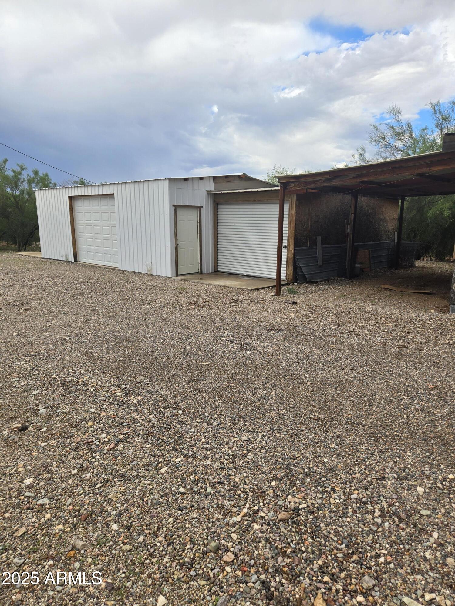 17963 West Patrick Lane, Unit 5 Surprise, AZ 85387 - Photo 5 of 15 a view of garage and yard