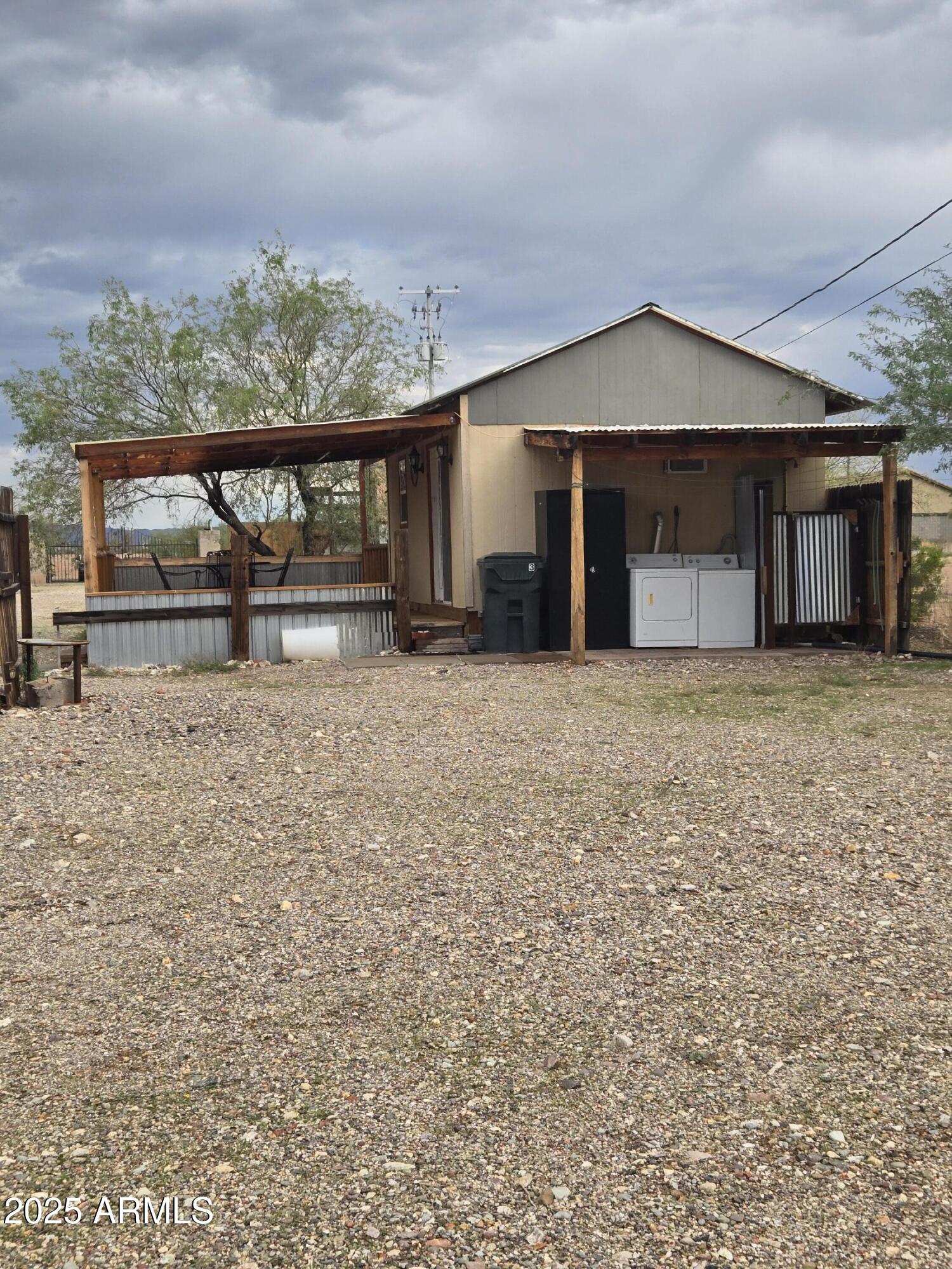 17963 West Patrick Lane, Unit 5 Surprise, AZ 85387 - Photo 8 of 15 a view of a house with a yard