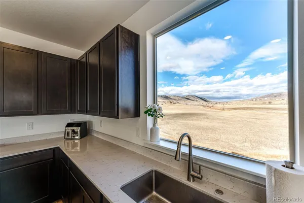 a kitchen with a sink and a window