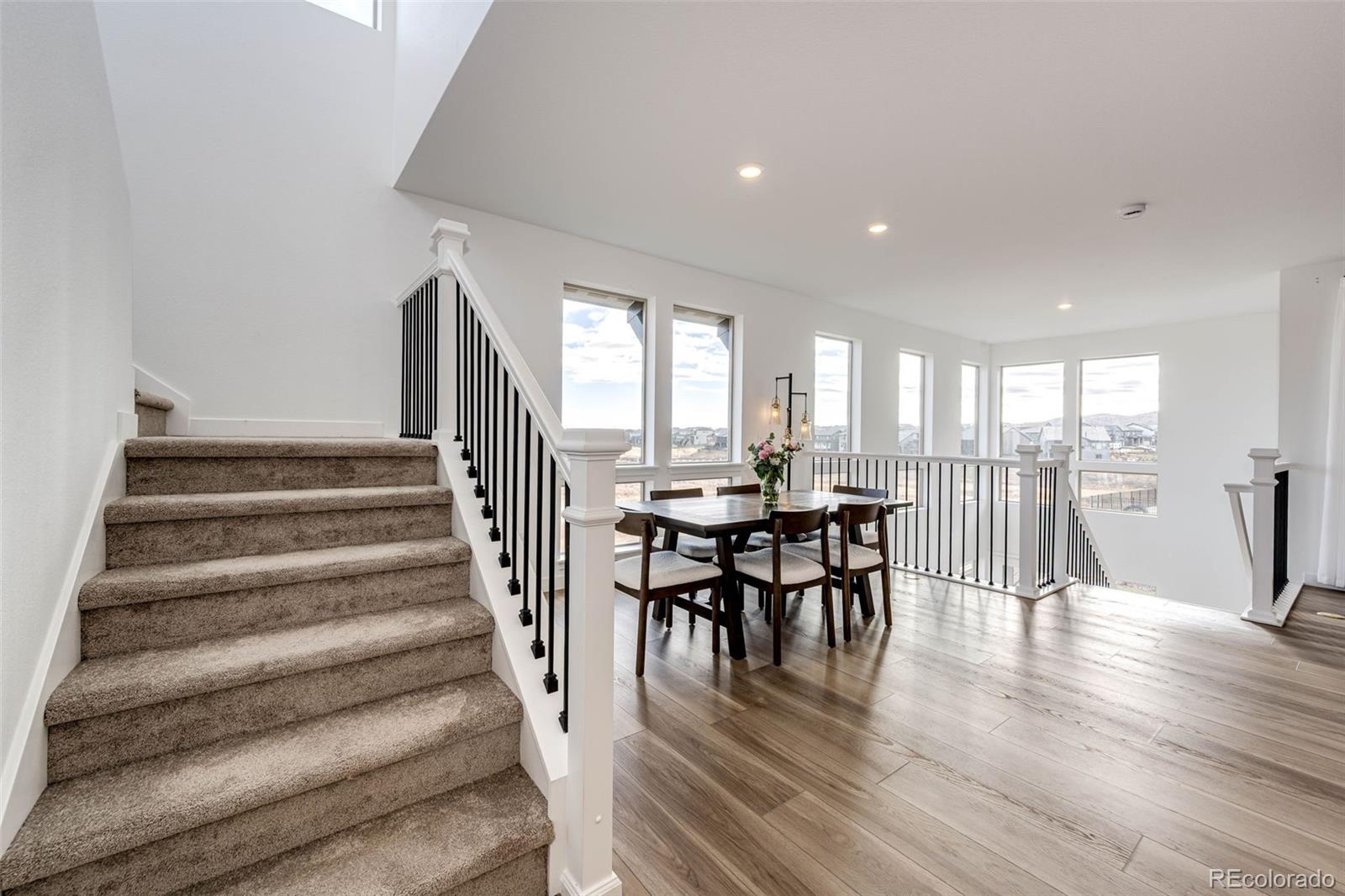 3100 South Russell Street Morrison, CO 80465 - Photo 12 of 29 a view of a dining room with furniture and wooden floor