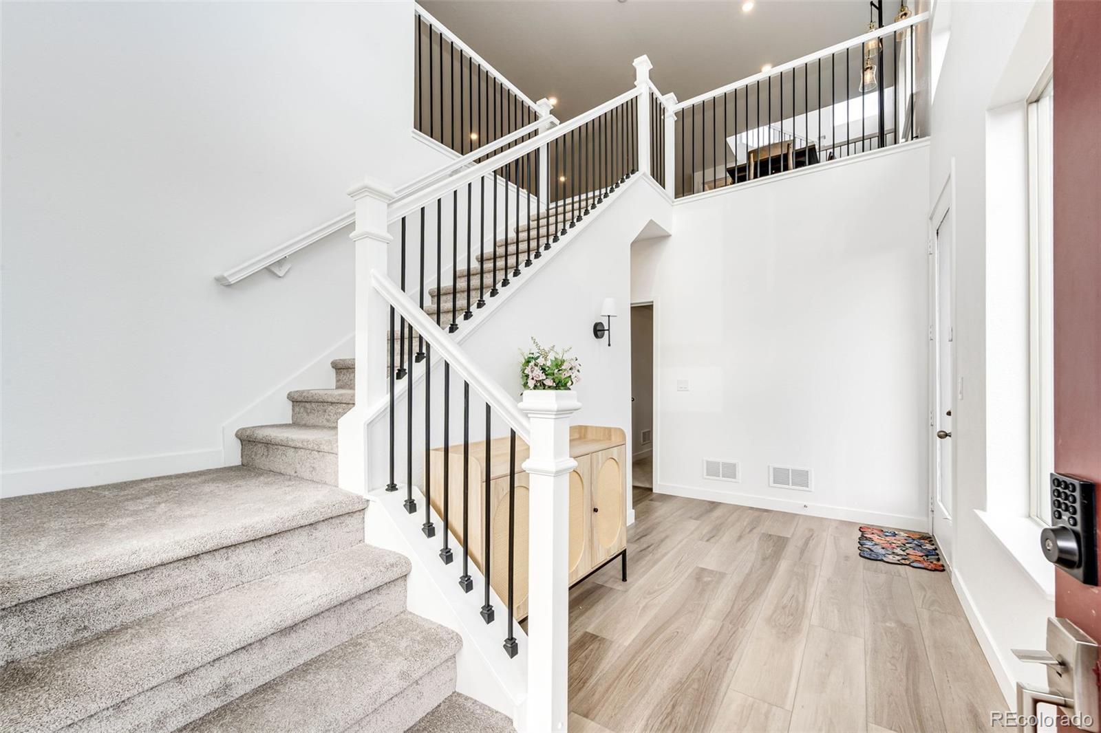 3100 South Russell Street Morrison, CO 80465 - Photo 16 of 29 a view of entryway and hall with wooden floor