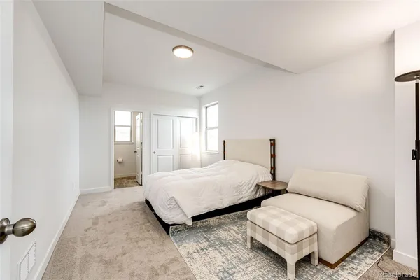 a bedroom with two beds and painted walls