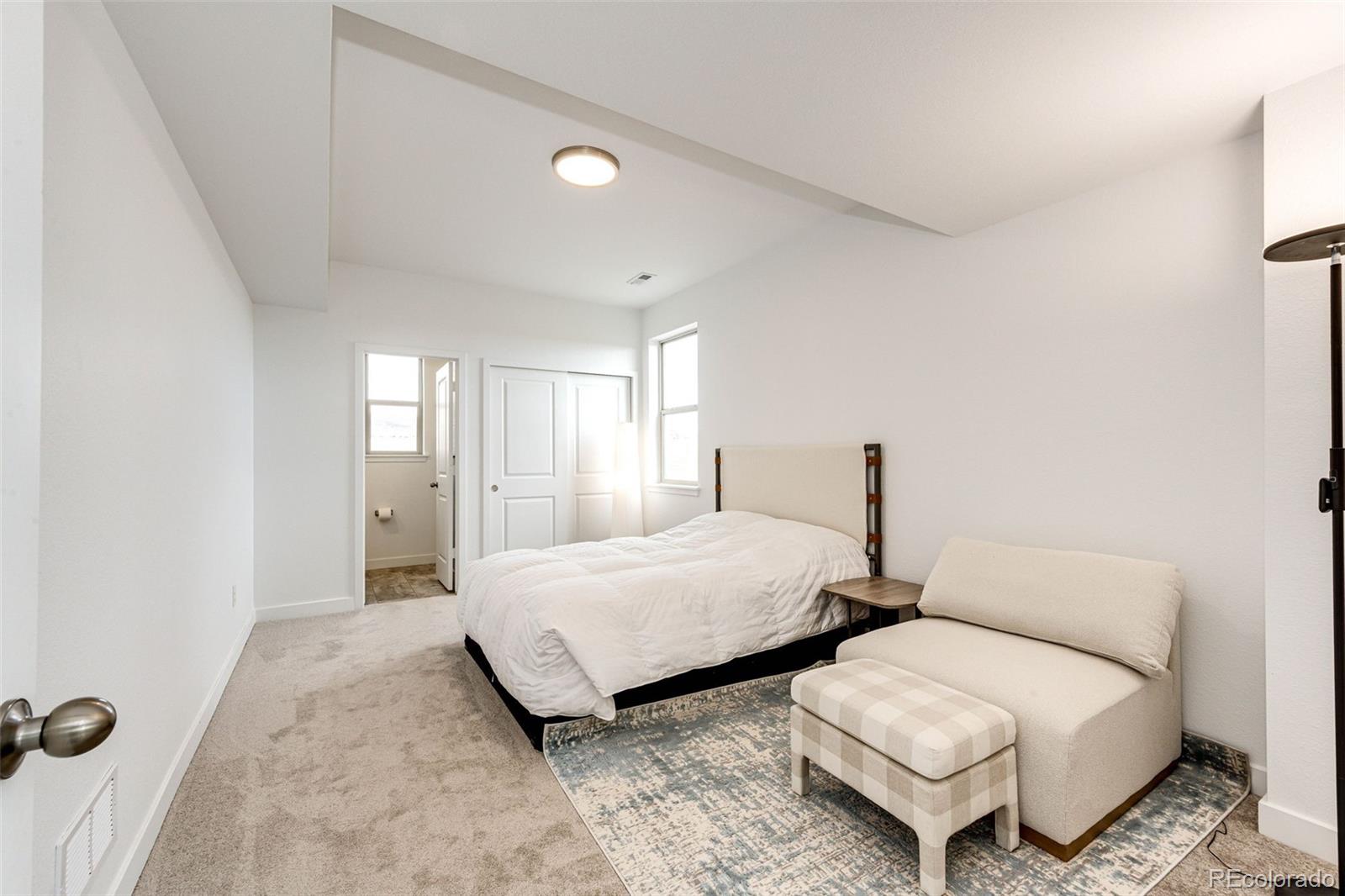 3100 South Russell Street Morrison, CO 80465 - Photo 21 of 29 a bedroom with two beds and painted walls