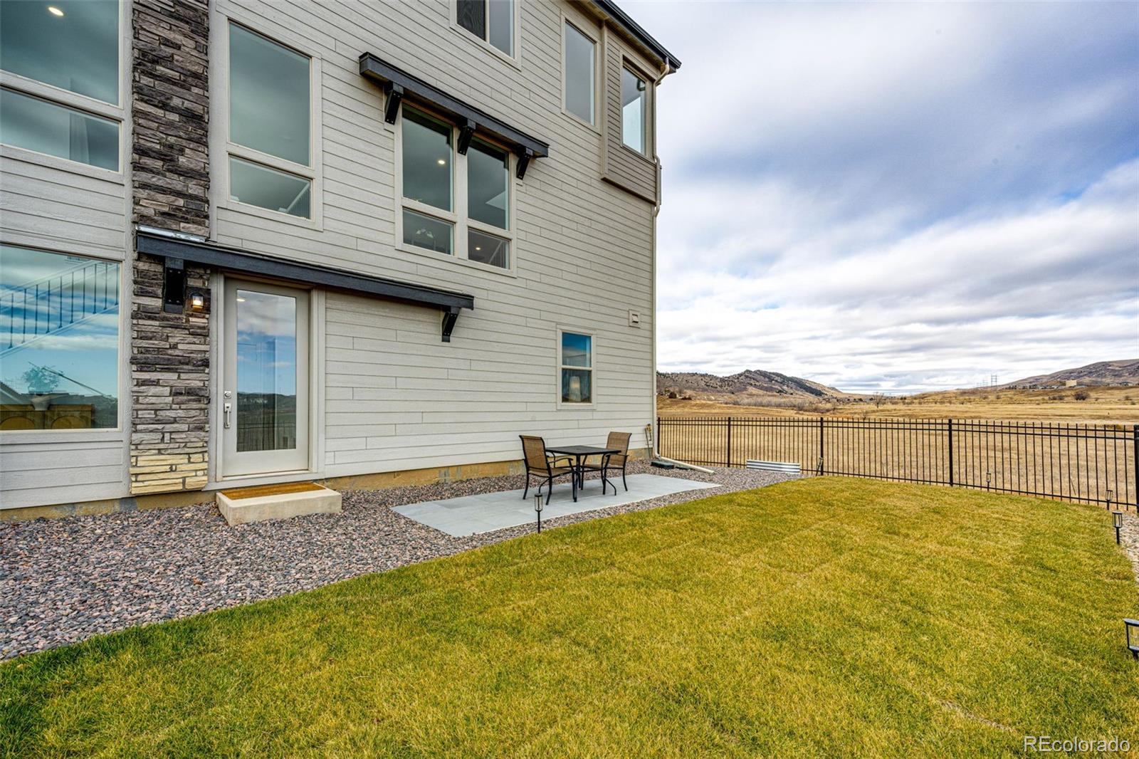3100 South Russell Street Morrison, CO 80465 - Photo 28 of 29 a view of a patio with a table and chairs