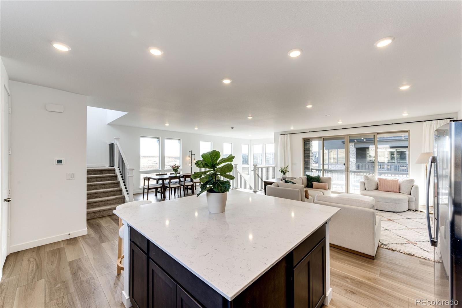3100 South Russell Street Morrison, CO 80465 - Photo 10 of 29 a view of a dining room with furniture and wooden floor