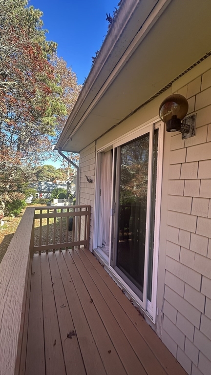 300 Buck Island Road, Unit 14F Yarmouth, MA 02673 - Photo 16 of 29 a view of a balcony with wooden floor