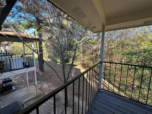 a view of trees from a balcony