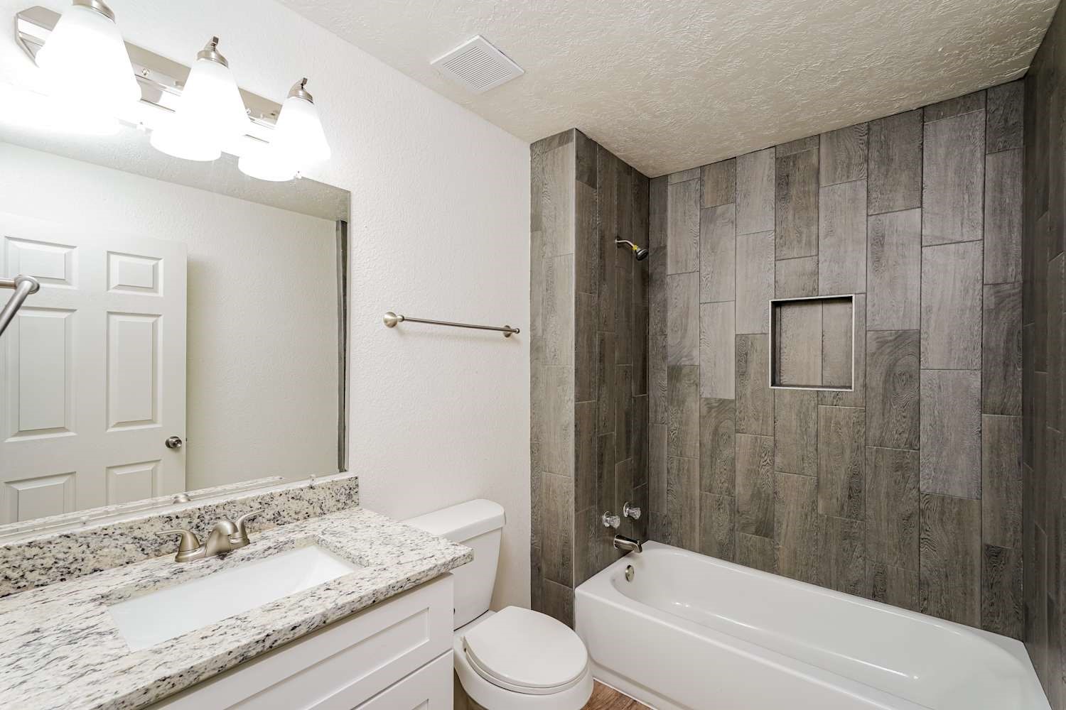 34306 Conroe Huffsmith Road Magnolia, TX 77354 - Photo 15 of 17 a bathroom with a granite countertop sink toilet and shower