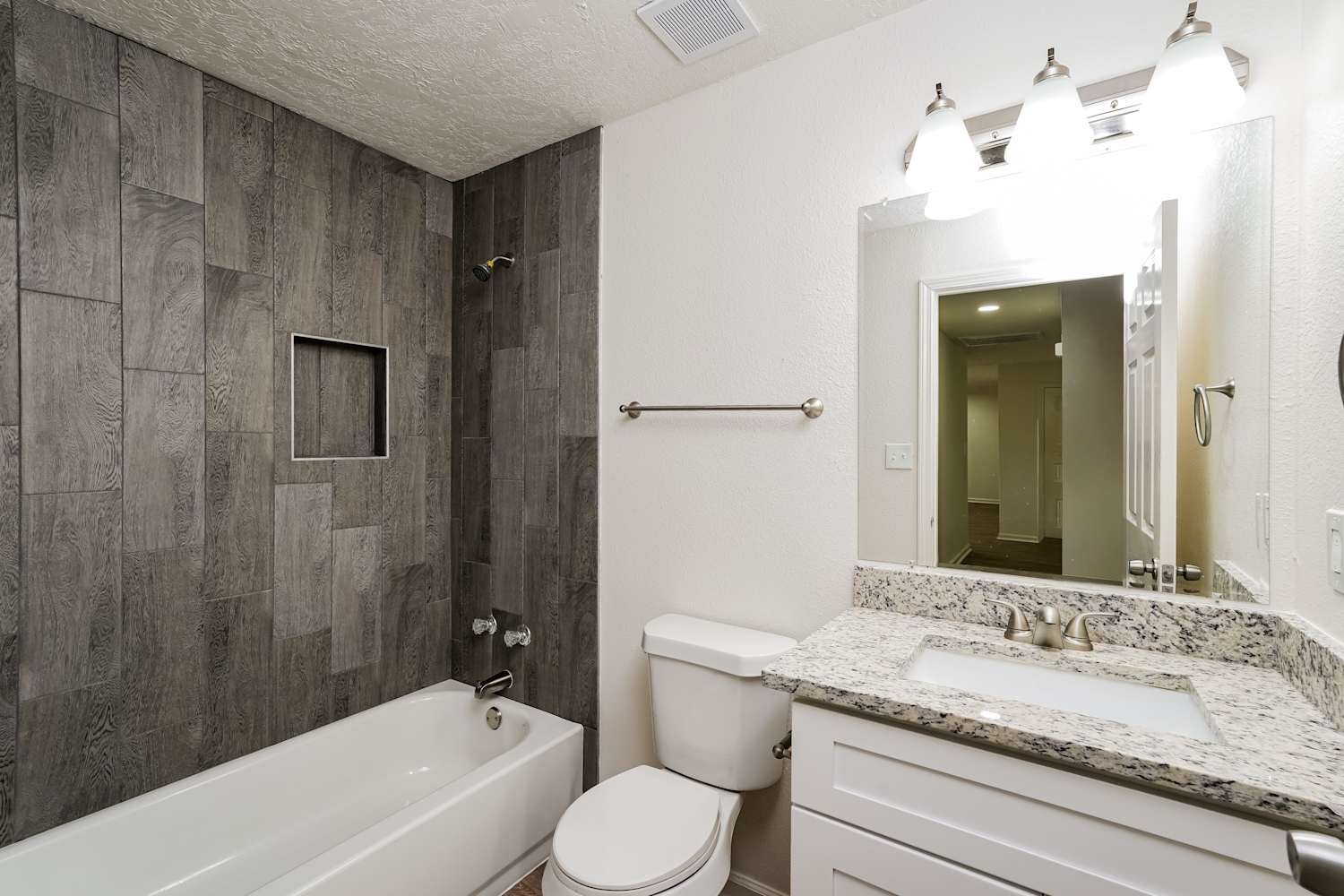 34306 Conroe Huffsmith Road Magnolia, TX 77354 - Photo 16 of 17 a bathroom with a granite countertop sink toilet and shower