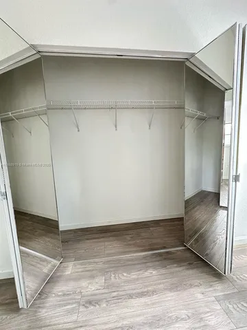 a bathroom with a double vanity sink and mirror