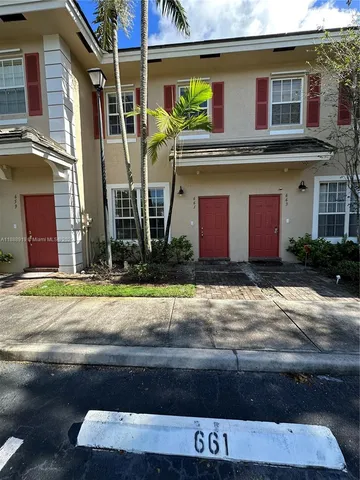 a front view of a house with a garage