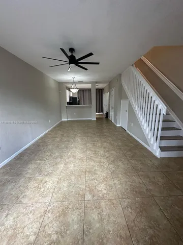 a view of a livingroom with a ceiling fan