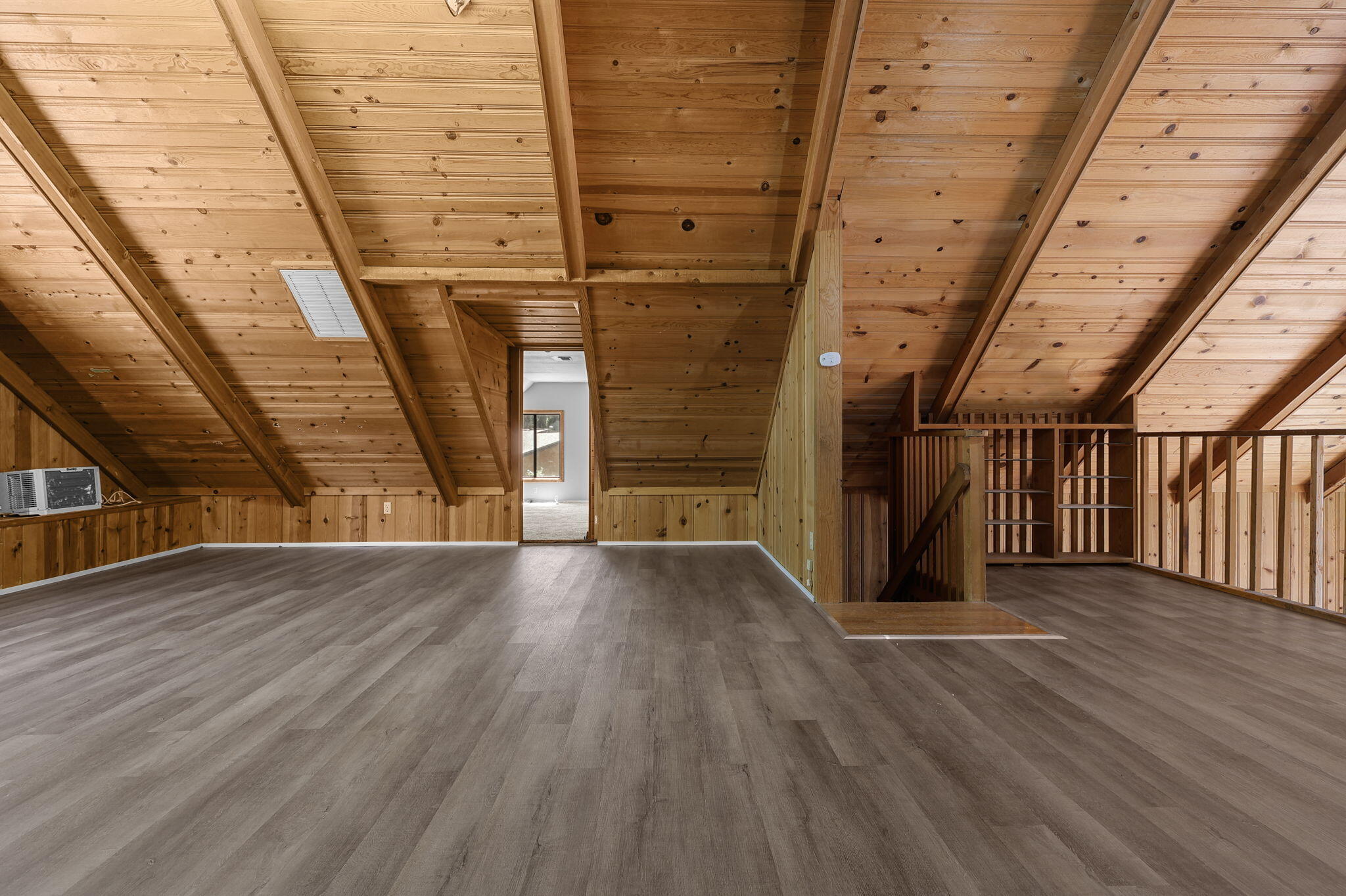 8238 Starlite Pines Road Shingletown, CA 96088 - Photo 14 of 25 a view of an empty room with wooden floor