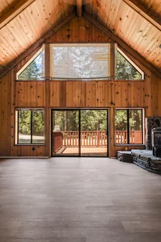 a view of an empty room with a large window
