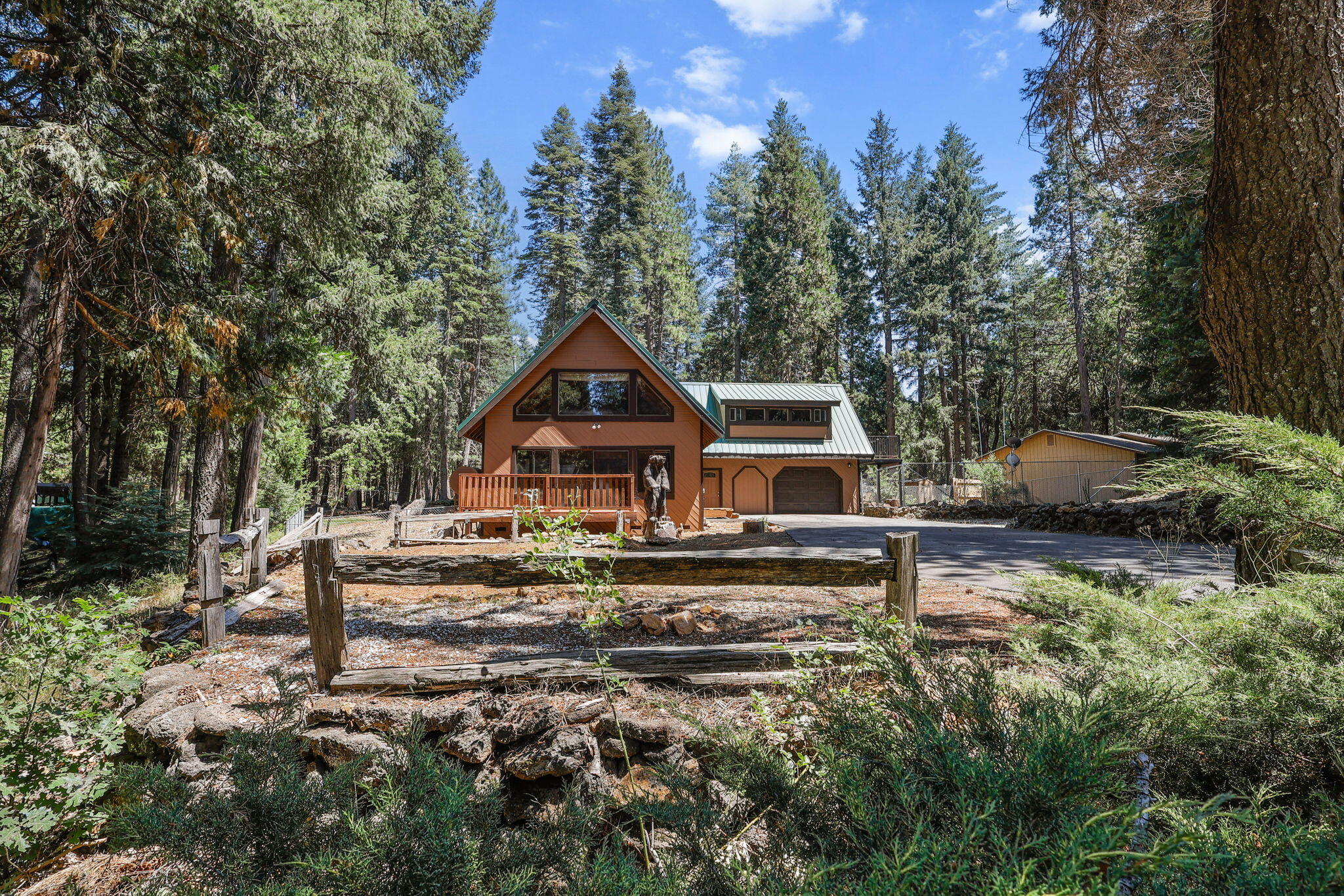 8238 Starlite Pines Road Shingletown, CA 96088 - Photo 21 of 25 a front view of a house with a yard