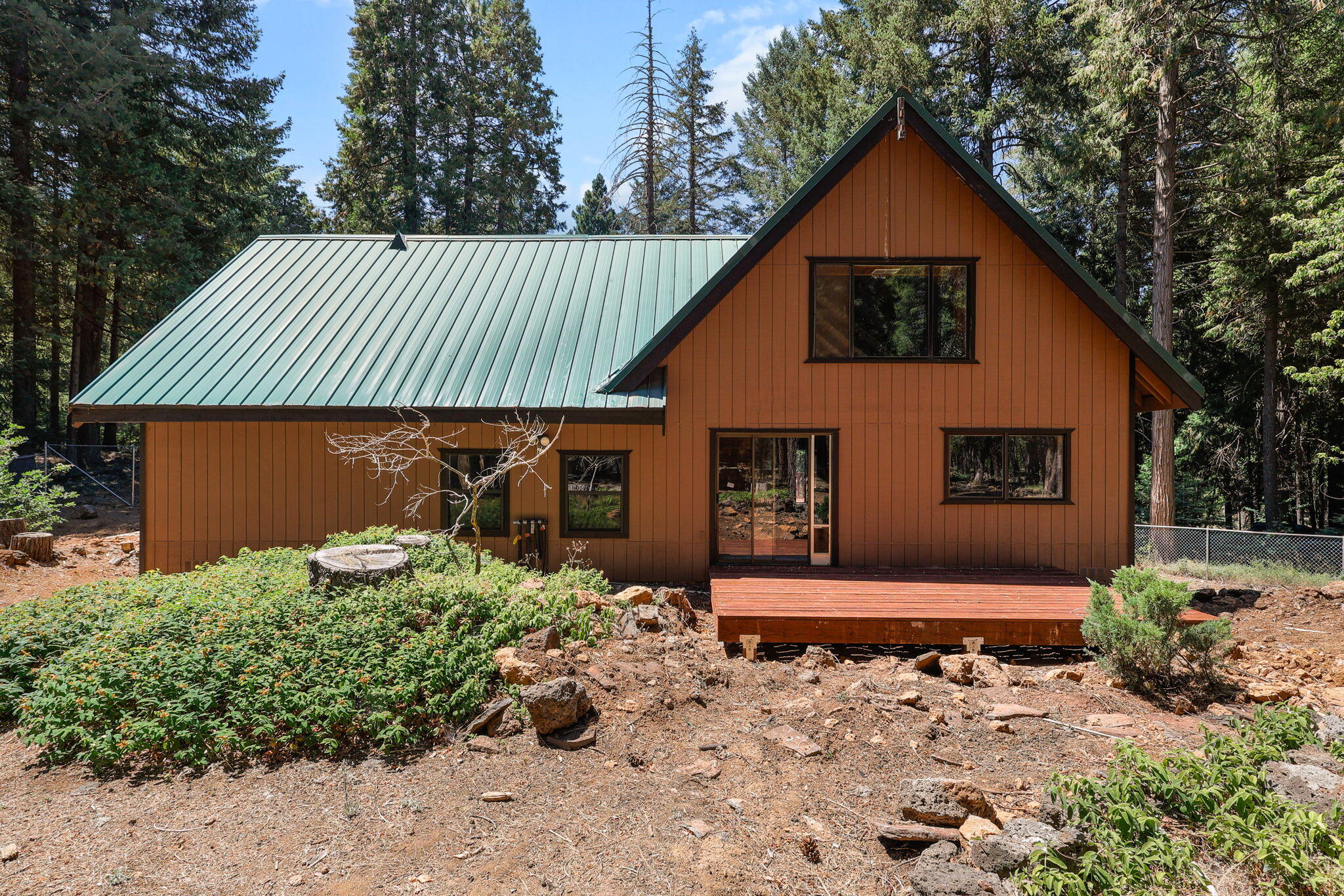 8238 Starlite Pines Road Shingletown, CA 96088 - Photo 23 of 25 a front view of a house with a yard