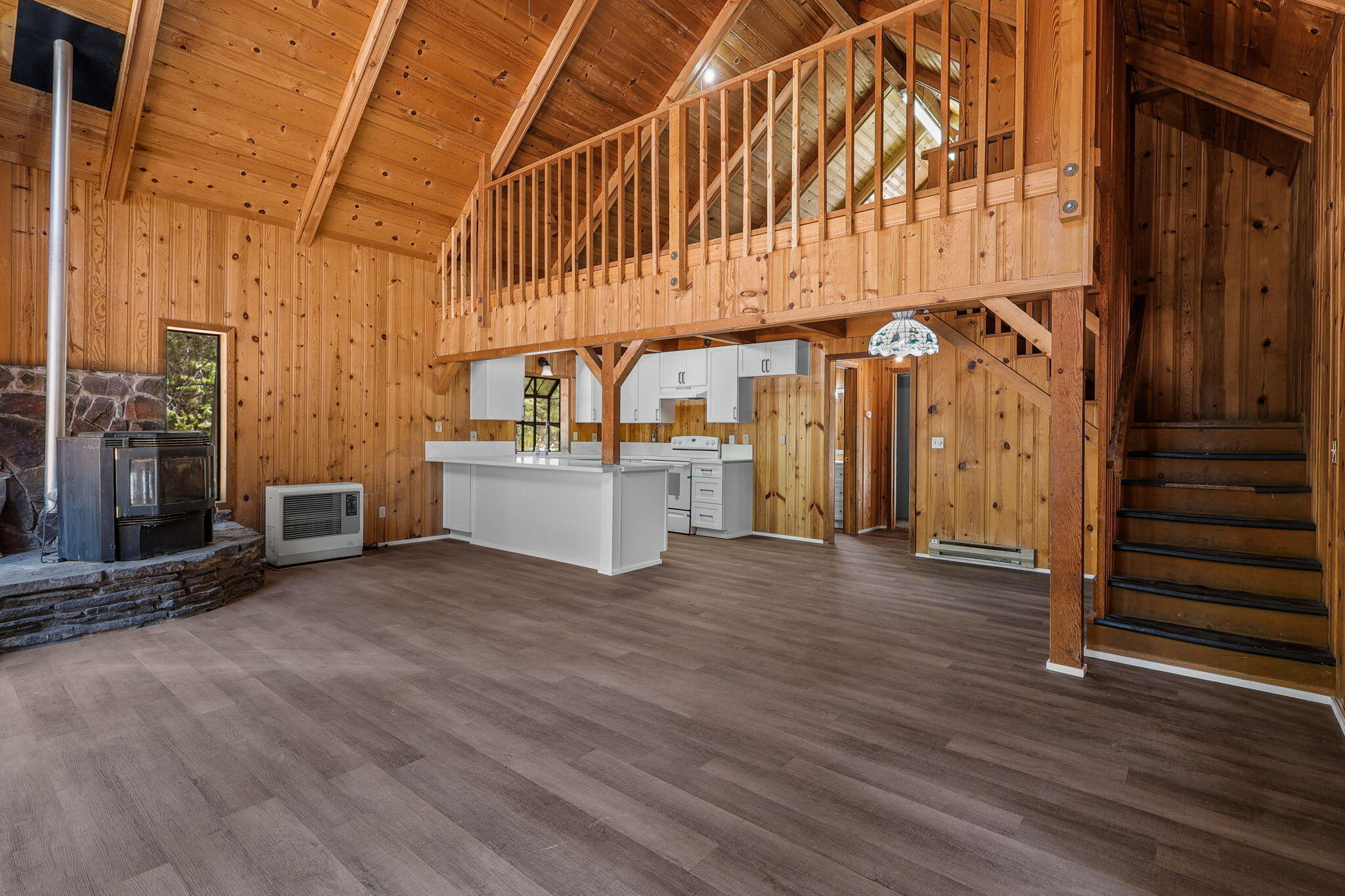 8238 Starlite Pines Road Shingletown, CA 96088 - Photo 3 of 25 a view of a room with wooden floor and stairs