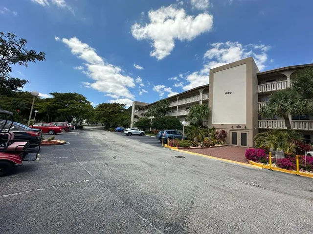 a view of street with parked cars