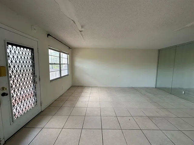 a view of an empty room and window