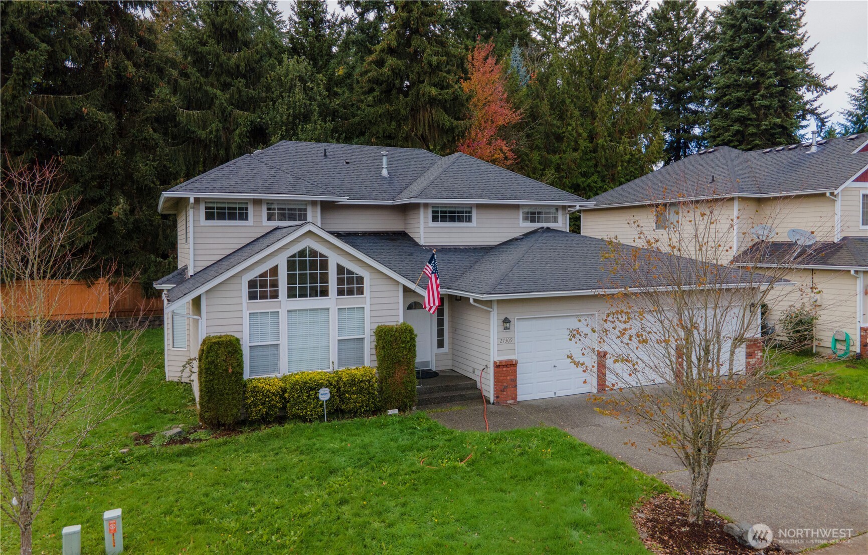 27309 111th Place Southeast Kent, WA 98030 - Photo 1 of 20 a front view of a house with a yard