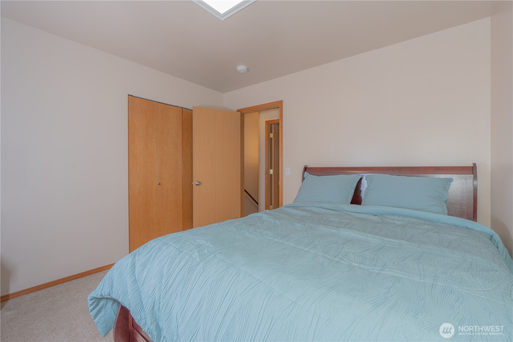 27309 111th Place Southeast Kent, WA 98030 - Photo 15 of 20 a bedroom with a bed and a night stand