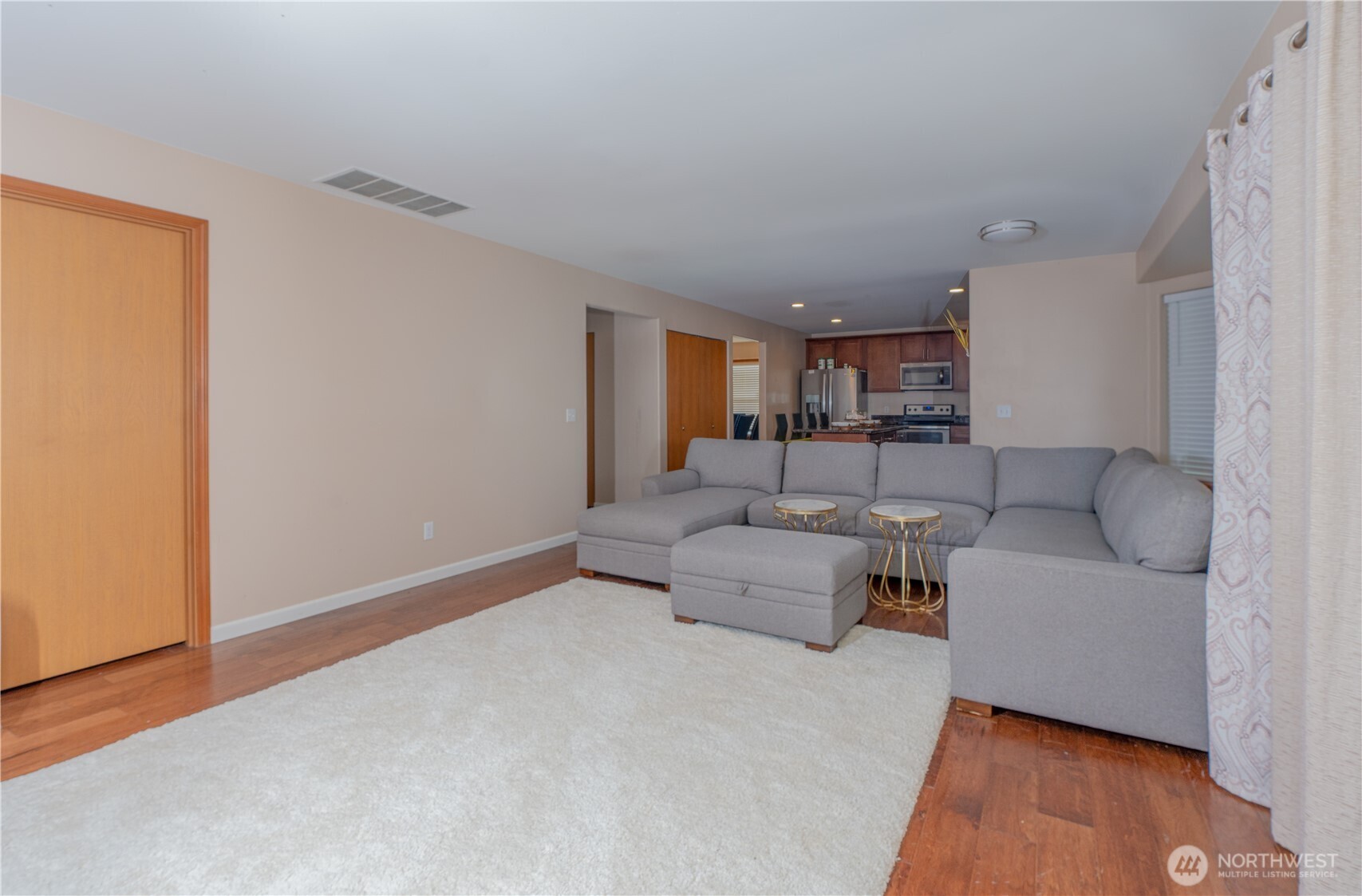 27309 111th Place Southeast Kent, WA 98030 - Photo 7 of 20 a living room with furniture and a wooden floor