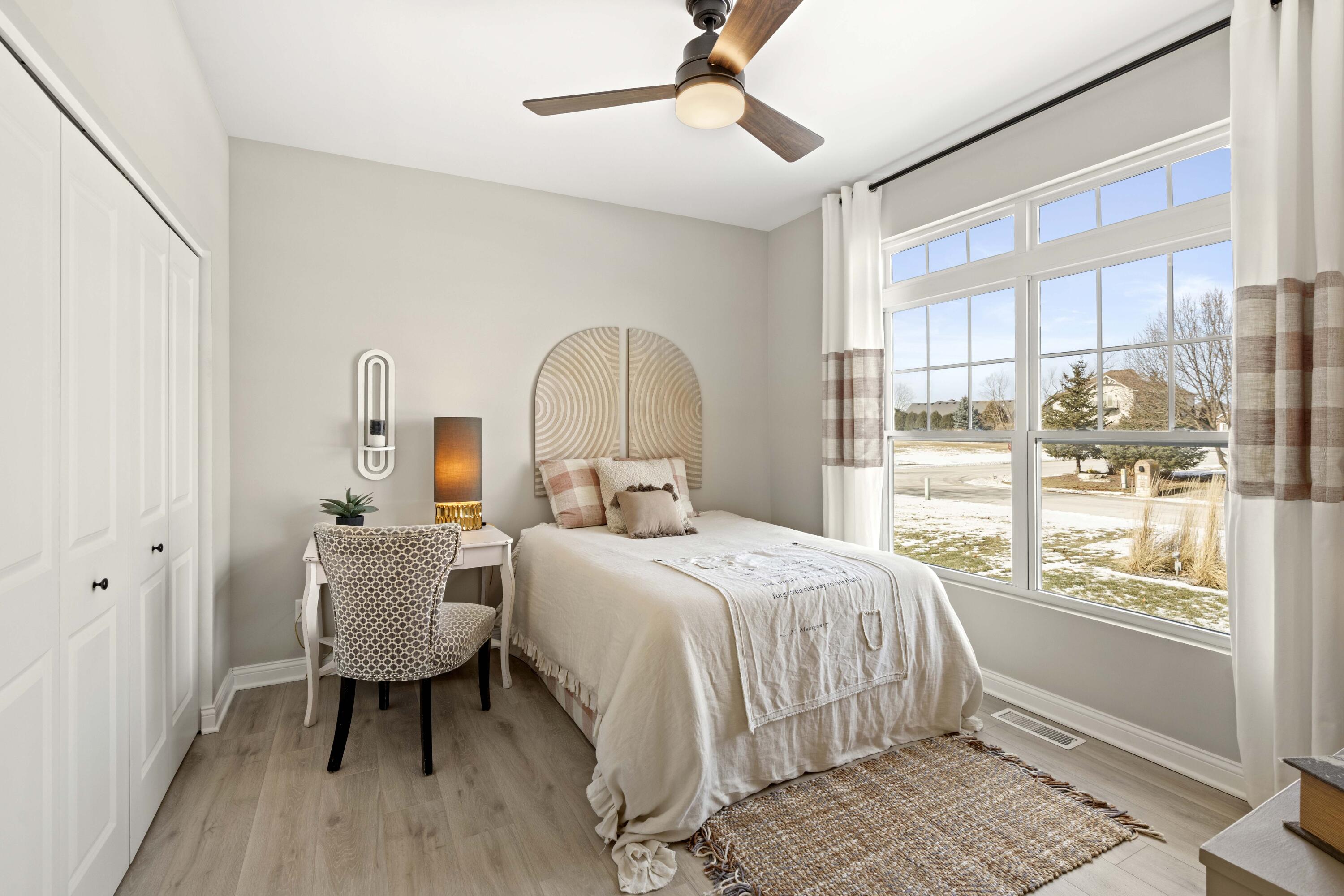 91 Bergamo Lane Crown Point, IN 46307 - Photo 5 of 29 a bedroom with a bed and a table