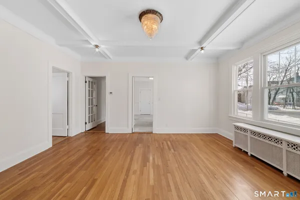 a view of staircase with white walls and a window