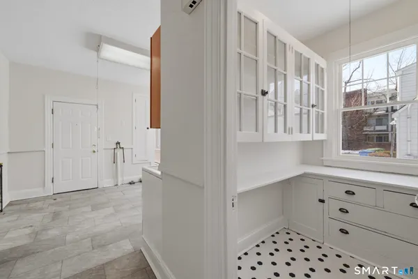 a spacious bathroom with a double vanity sink a mirror and a bathtub