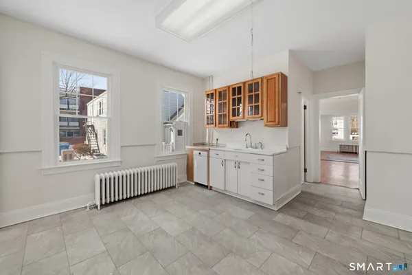 a bathroom with sink granite and mirror